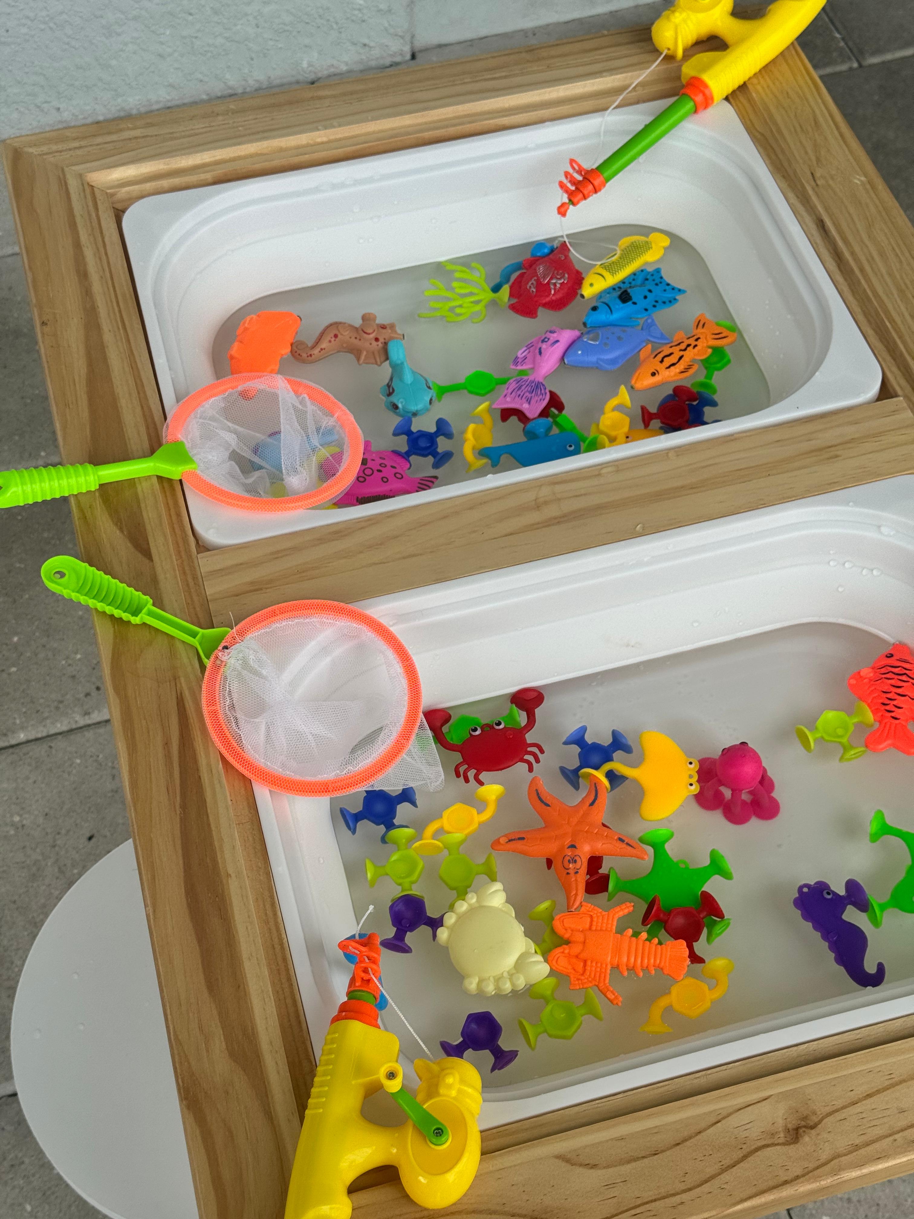 Water activity table with floating toys, scoops and pouring activities