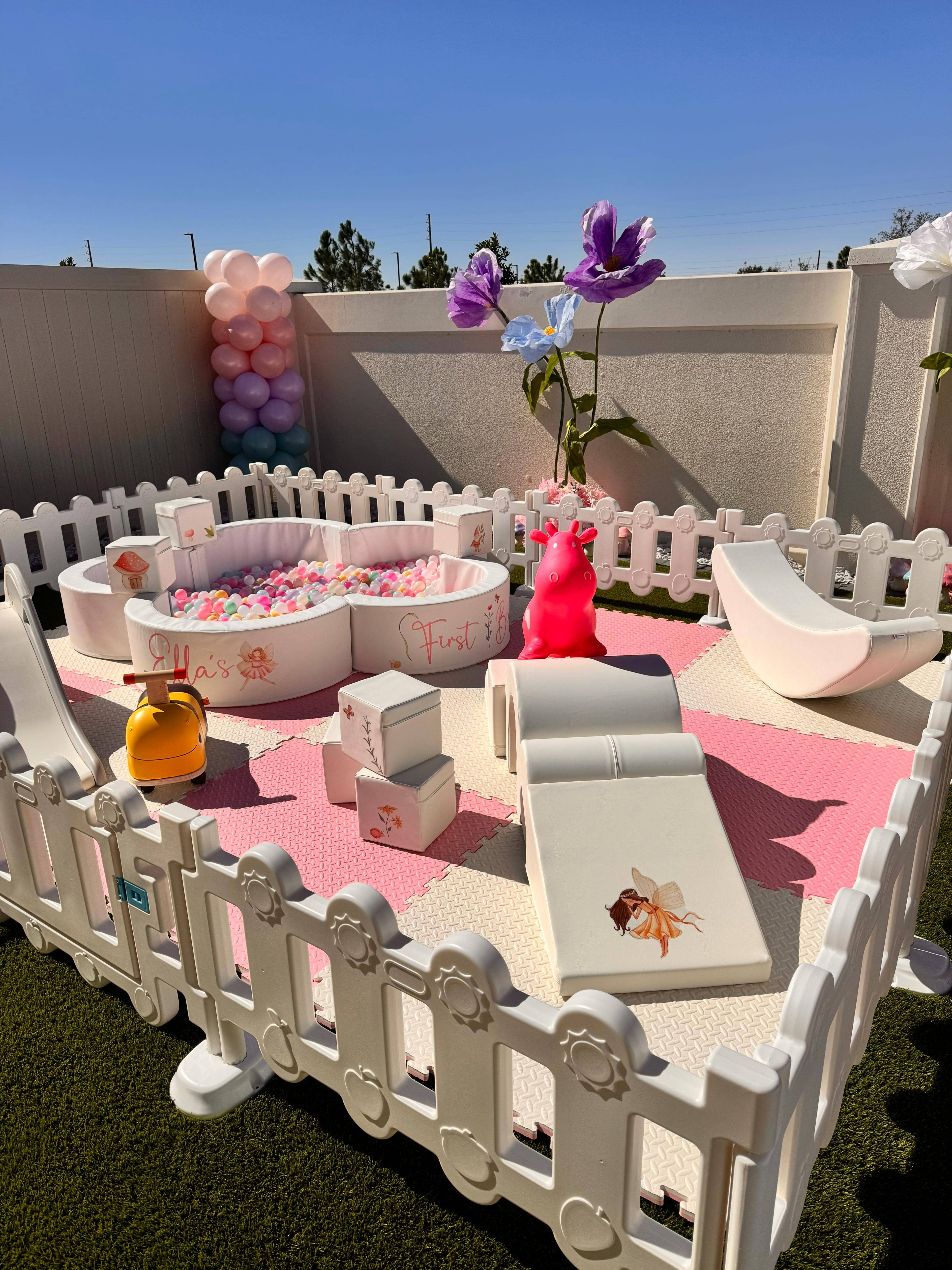 Blush and Bloom soft play setup with pink mats, ball pit and floral decor